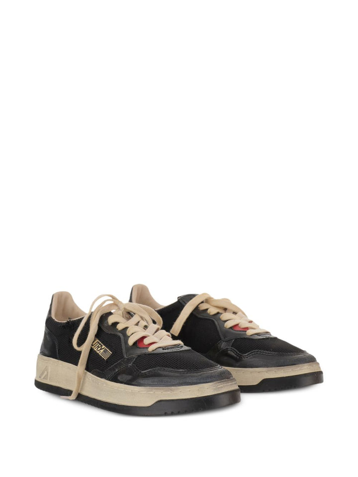 Sneakers nere con inserti 