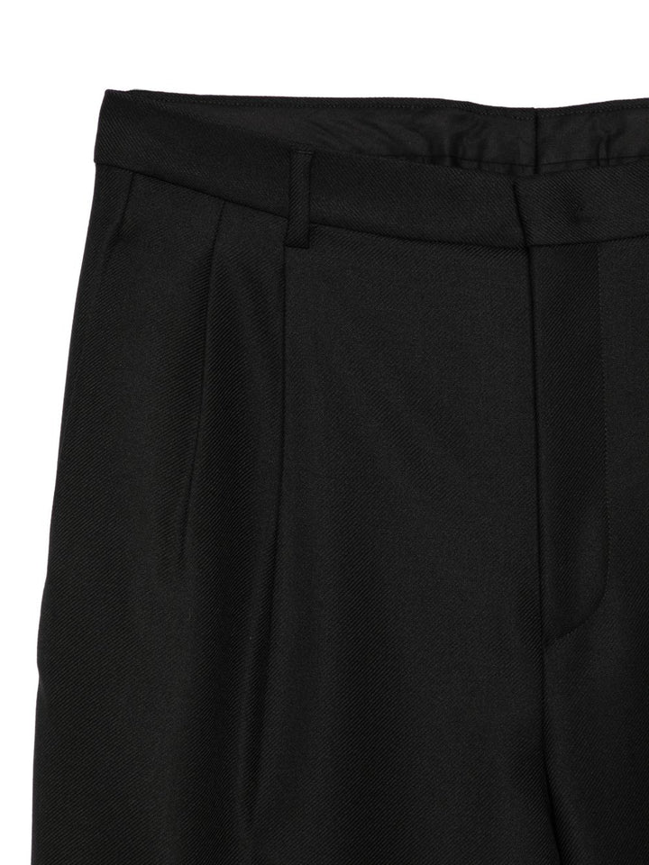 Pantaloni neri affusolati con pieghe 
