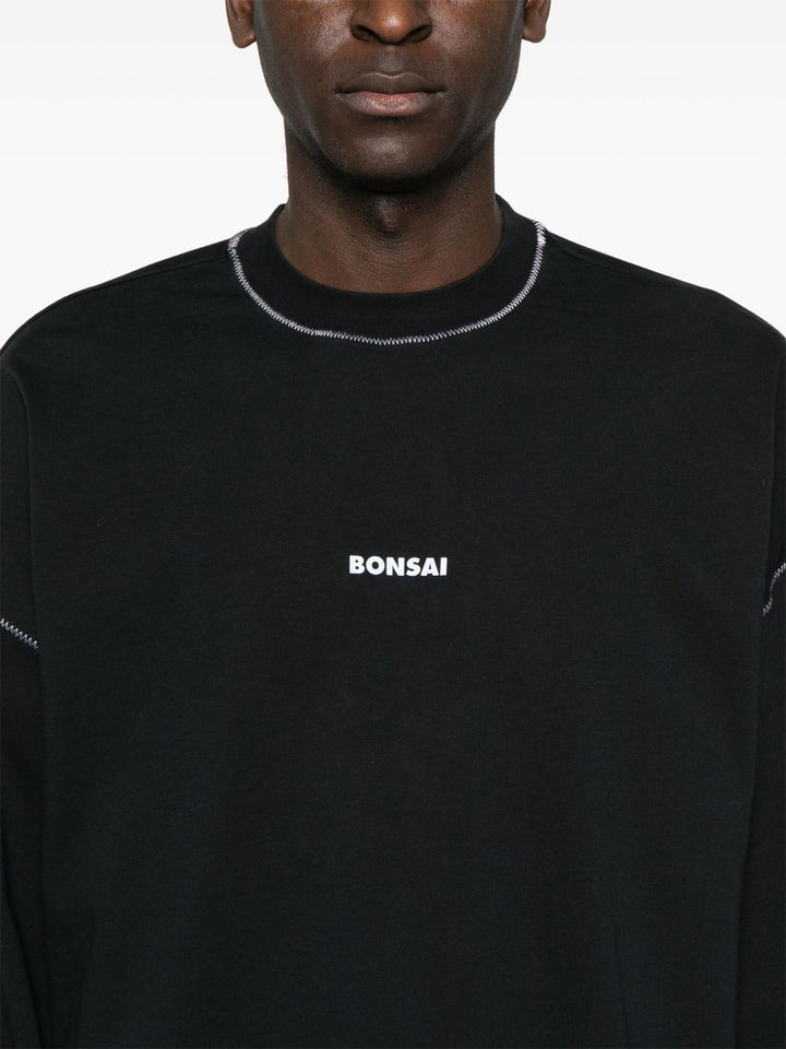 T-shirt nera a maniche lunghe in cotone con stampa 