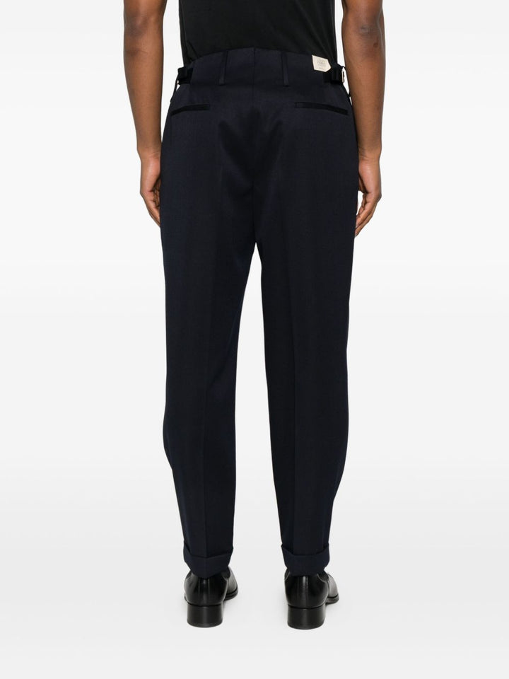 Pantaloni blu navy in lana con pieghe 