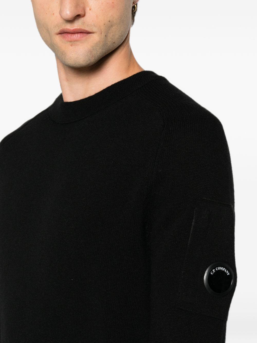 Maglione nero in lana con dettaglio Lente 