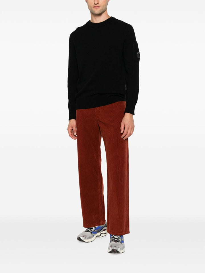 Maglione nero in lana con dettaglio Lente 