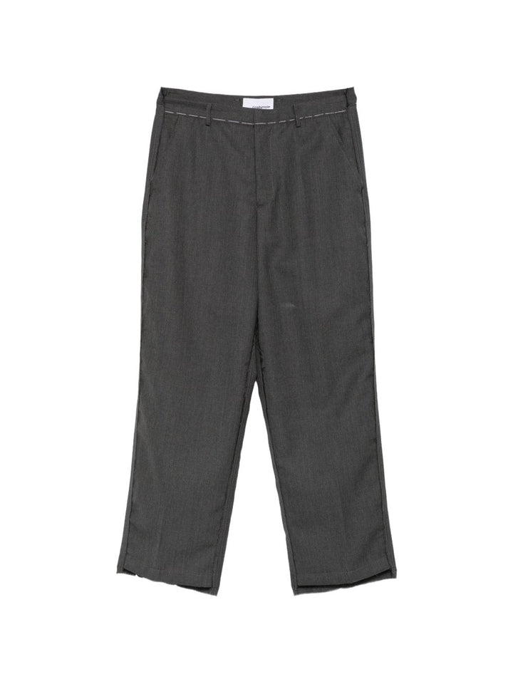 Pantaloni blu in lana vergine con cuciture a contrasto 