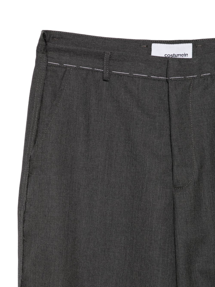 Pantaloni blu in lana vergine con cuciture a contrasto 