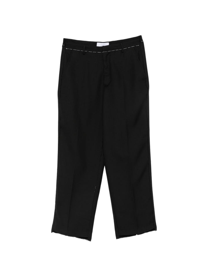 Pantaloni neri in lana vergine con cuciture a contrasto 