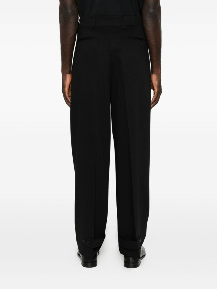 Pantaloni neri in lana vergine con pinces 