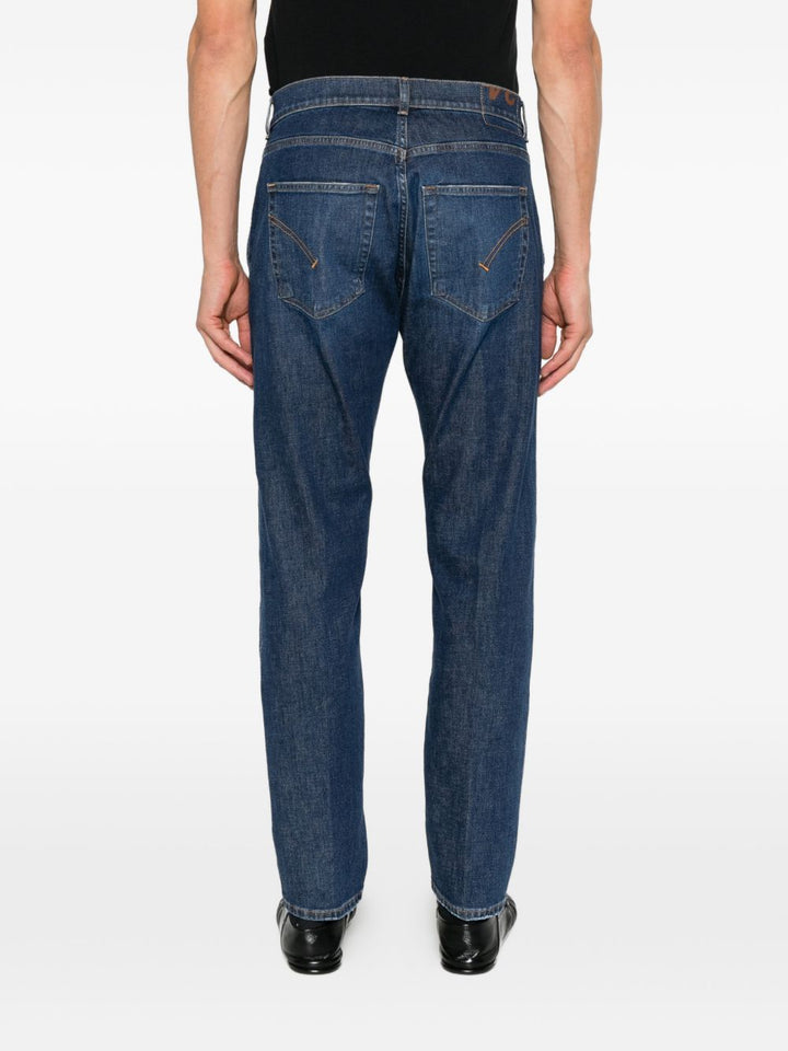 Jeans con impunture a contrasto e logo blu 