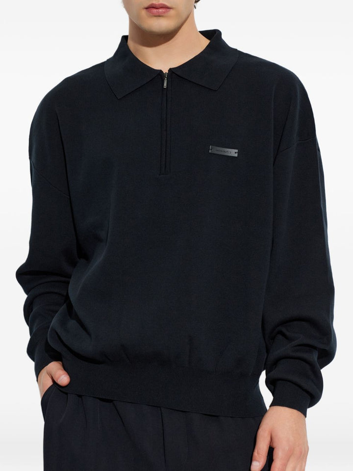 Polo nera con mezza zip 