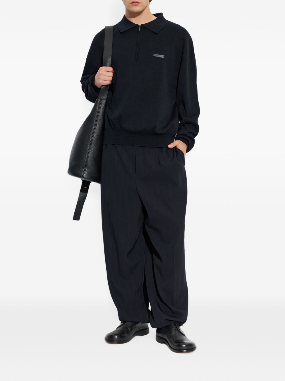 Polo nera con mezza zip 