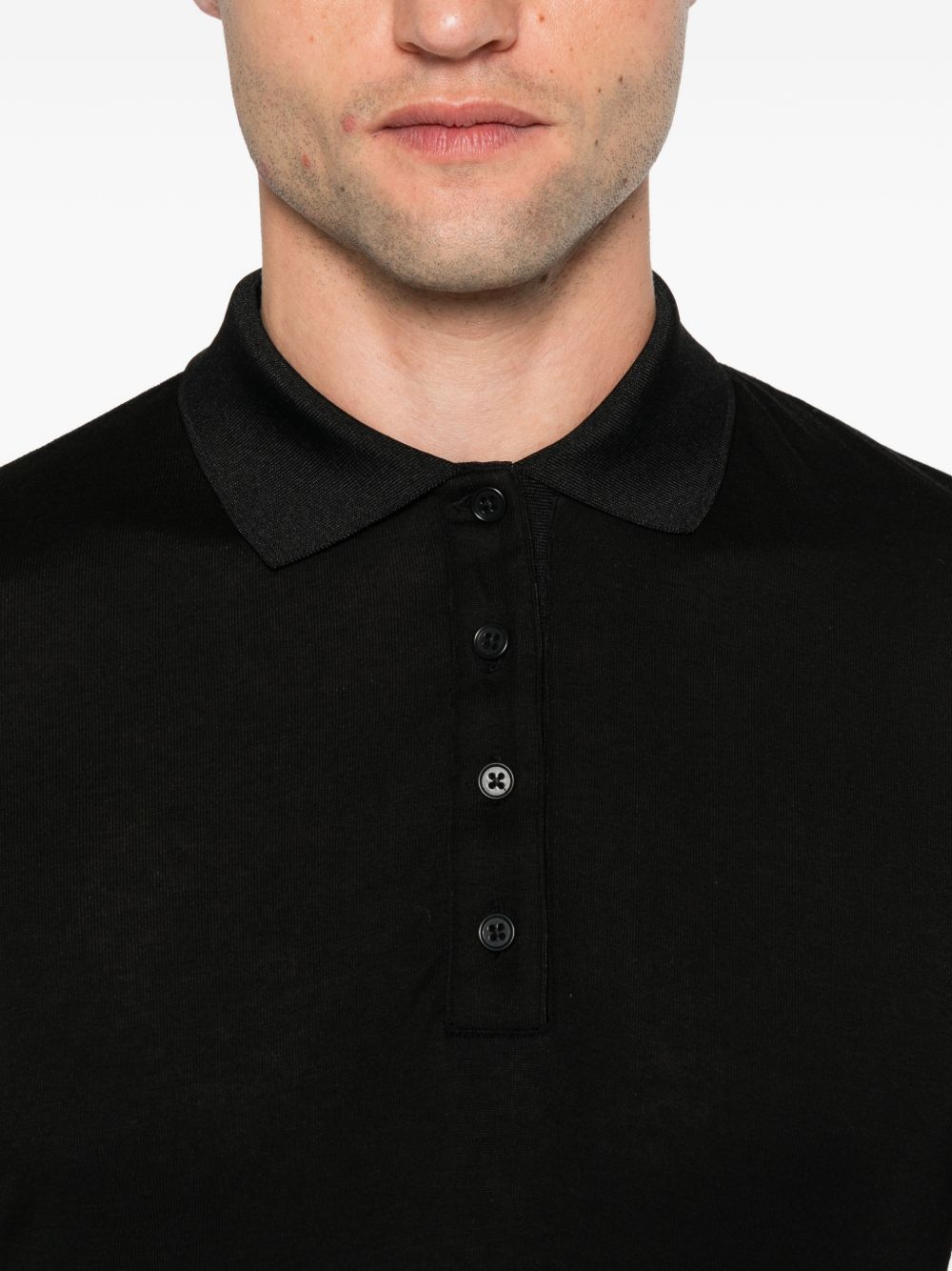 Polo a maniche lunghe in maglia nera 