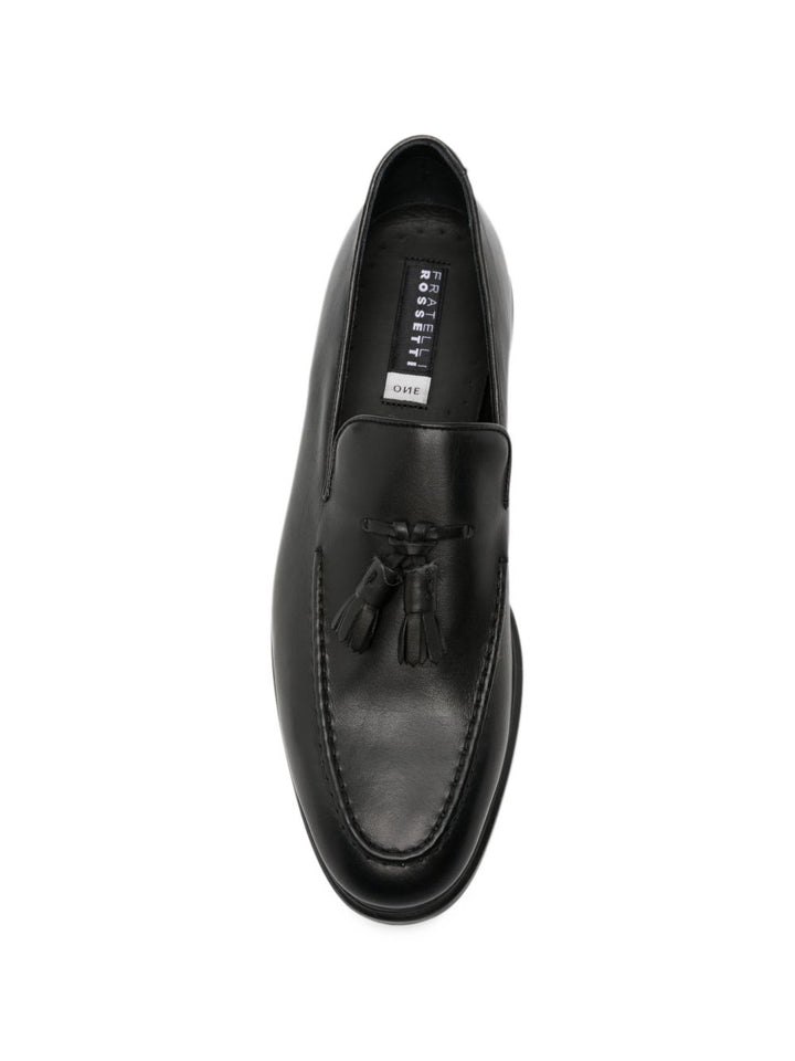 Mocassini con nappine in pelle nera 
