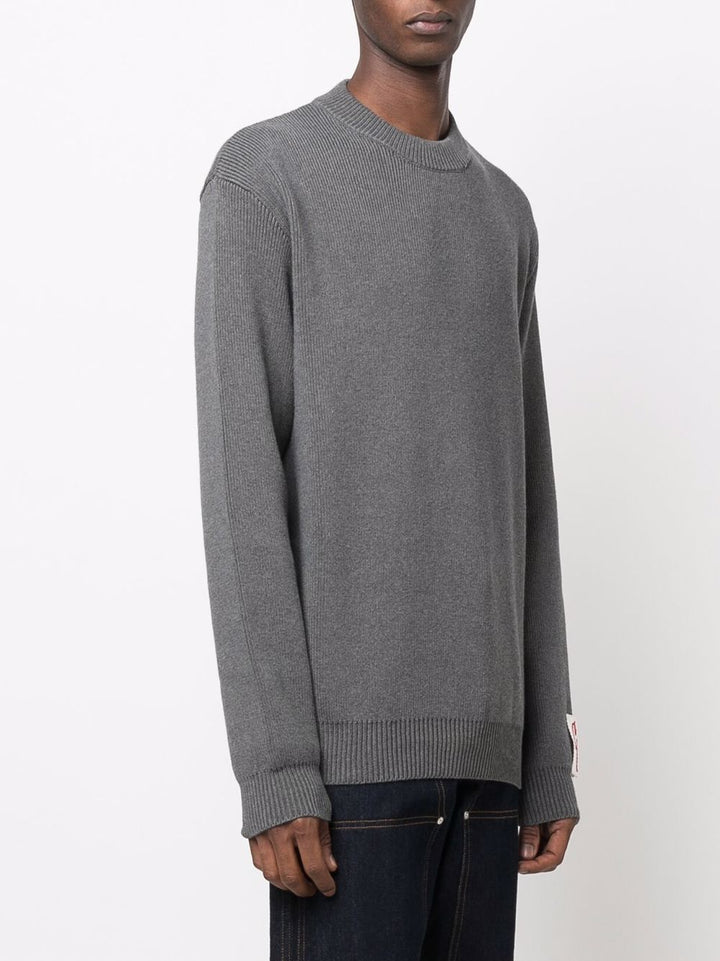 Maglione grigio con applicazione 