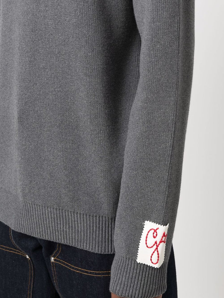 Maglione grigio con applicazione 