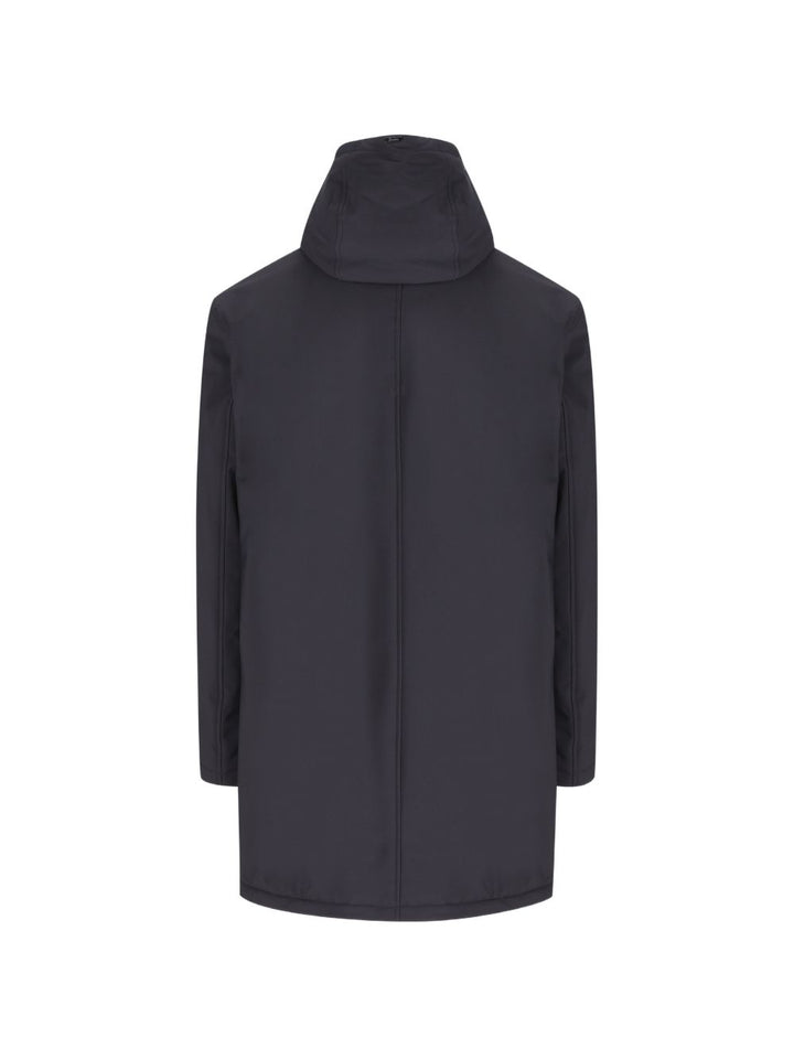 Giacca blu  con cappuccio e rifiniture in pelliccia sintetica 