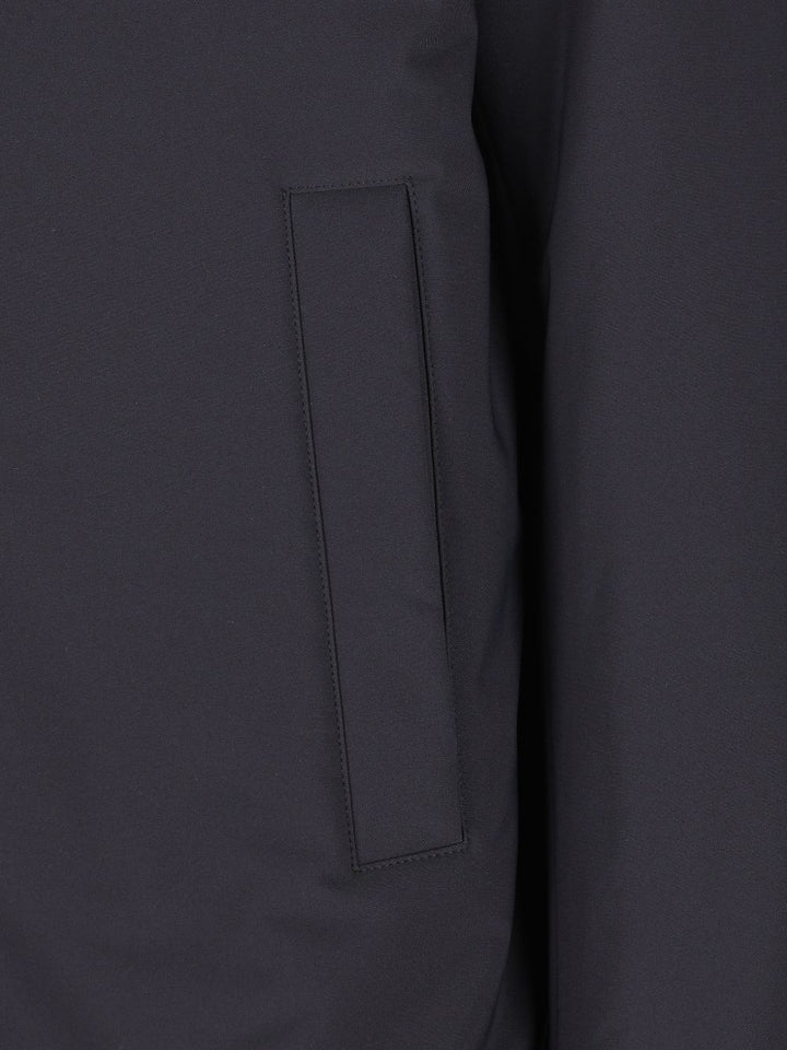 Giacca blu  con cappuccio e rifiniture in pelliccia sintetica 