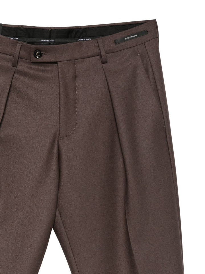 Pantaloni marroni Freddy affusolati con pieghe 