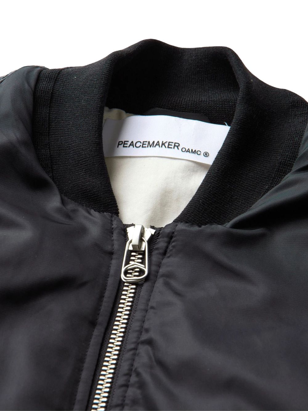 Bomber nero con ricamo Peacemaker OAM 