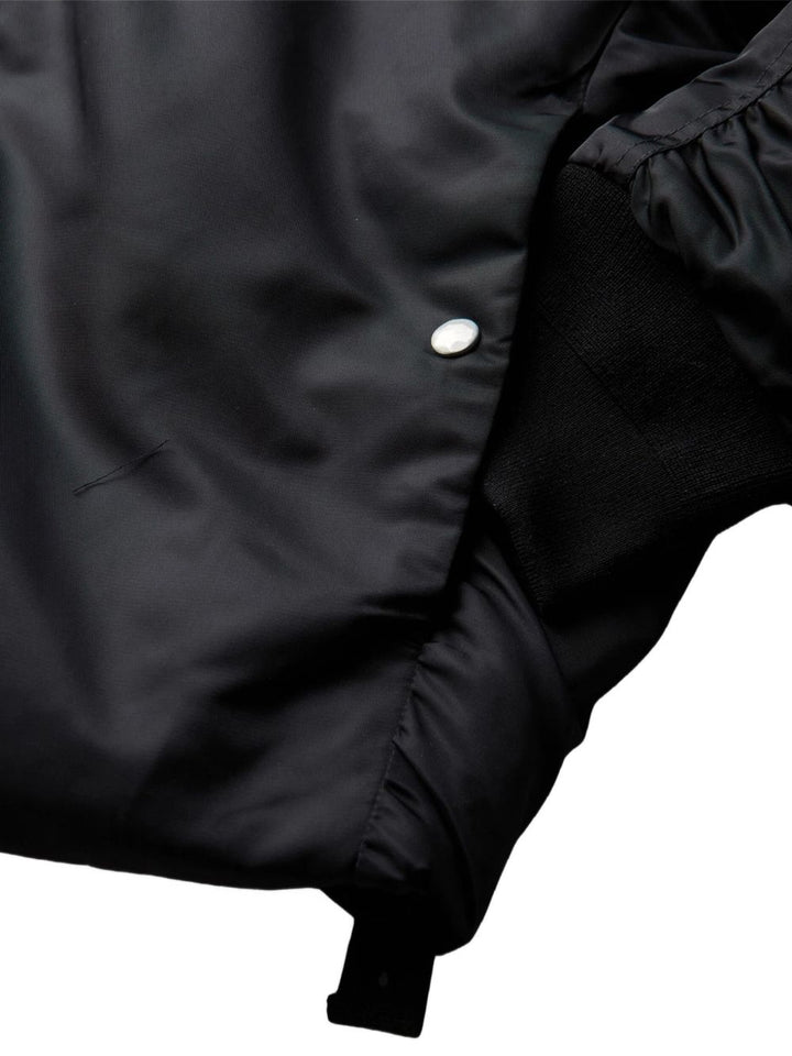 Bomber nero con ricamo Peacemaker OAM 