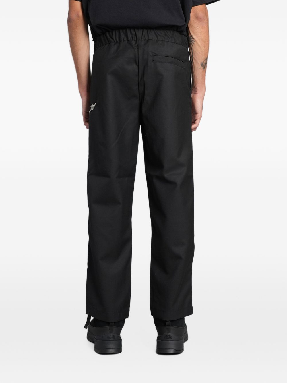 Pantaloni neri Oamc Peacemaker con cintura e zip 