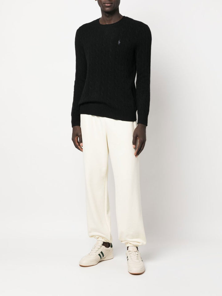 Maglione nero a trecce con ricamo 