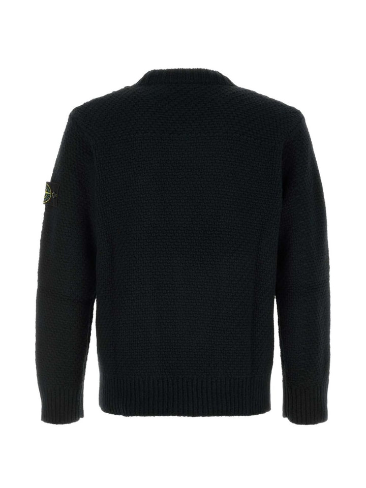 Maglione nero girocollo in lana con lavorazione a intreccio 