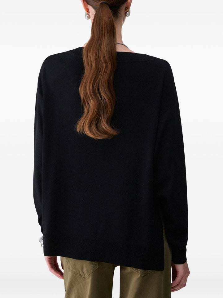 Maglione con ritagli ricamati 