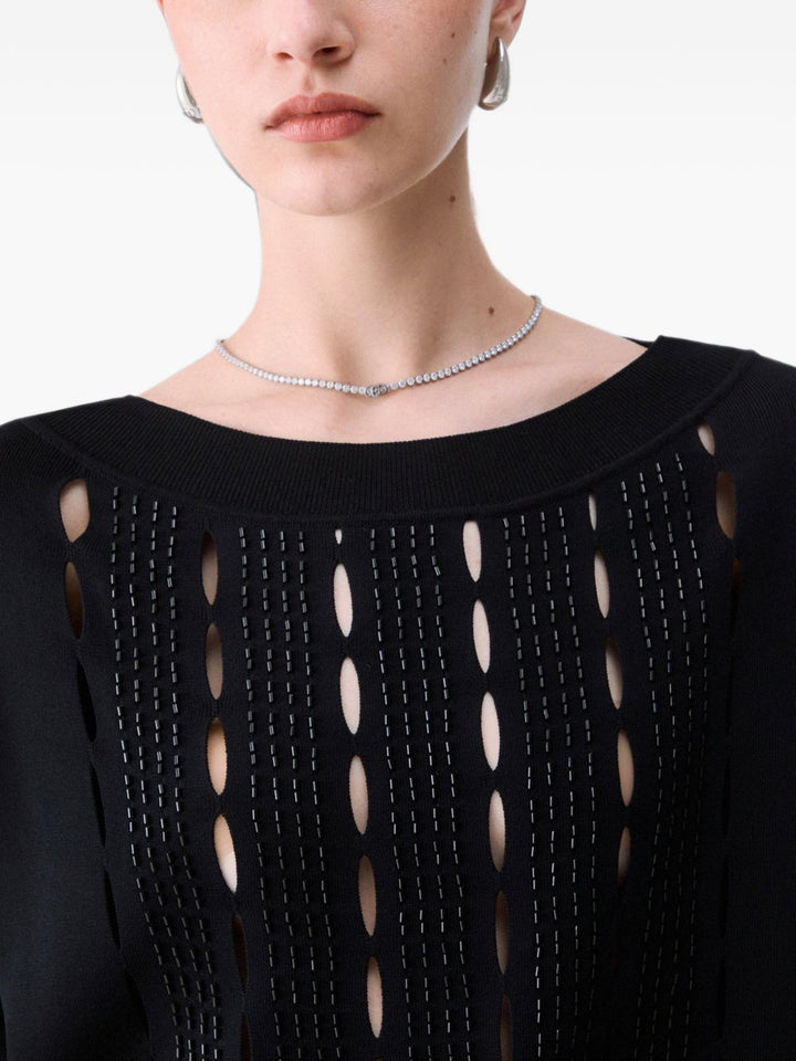 Maglione con ritagli ricamati 