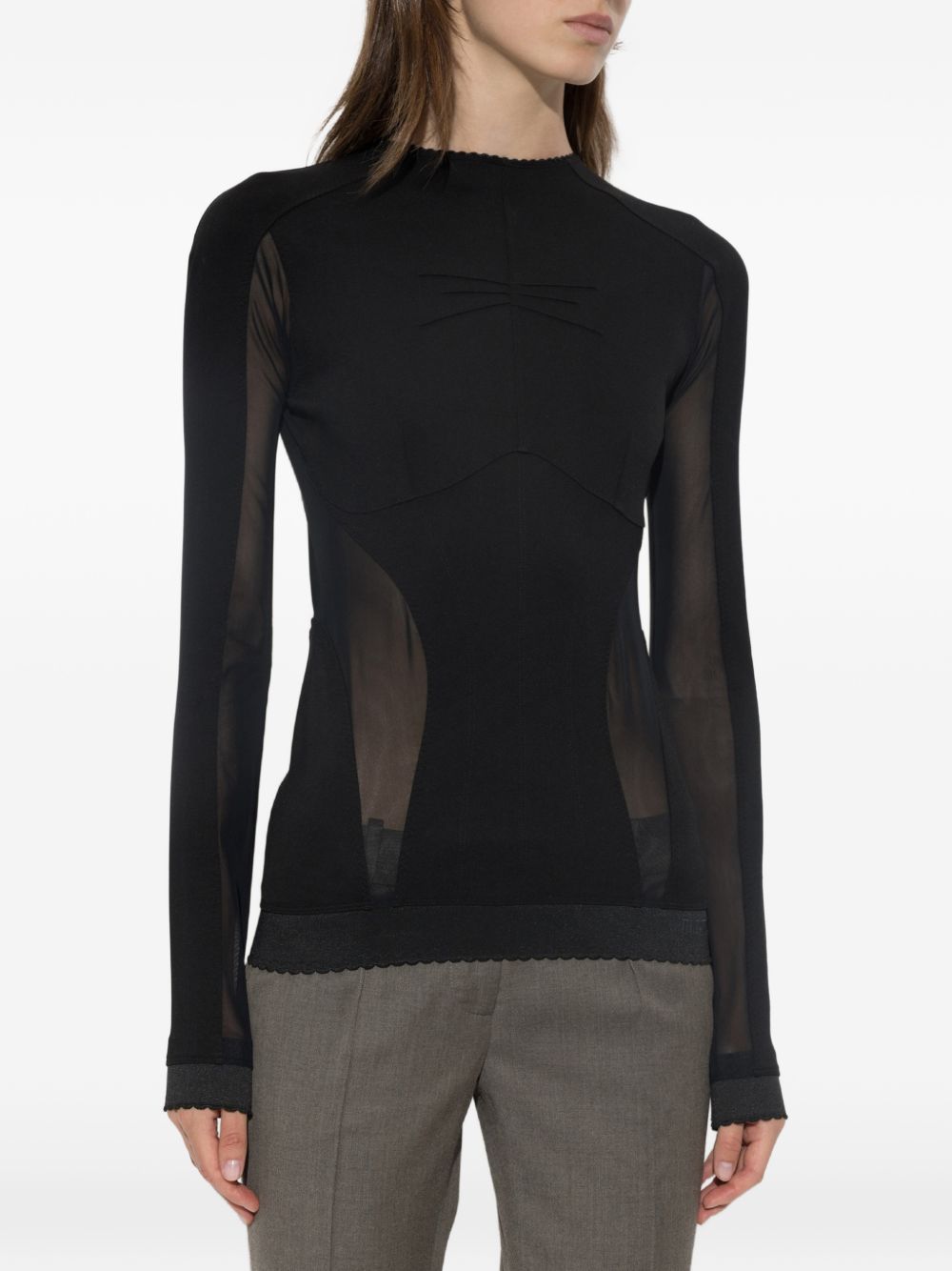 Top a maniche lunghe con inserti trasparenti 