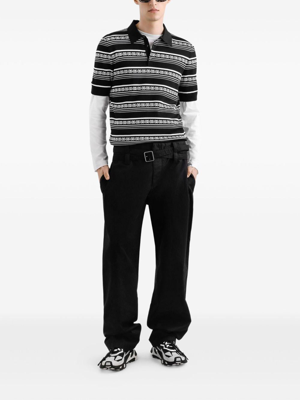 Polo nera in seta con logo all-over 