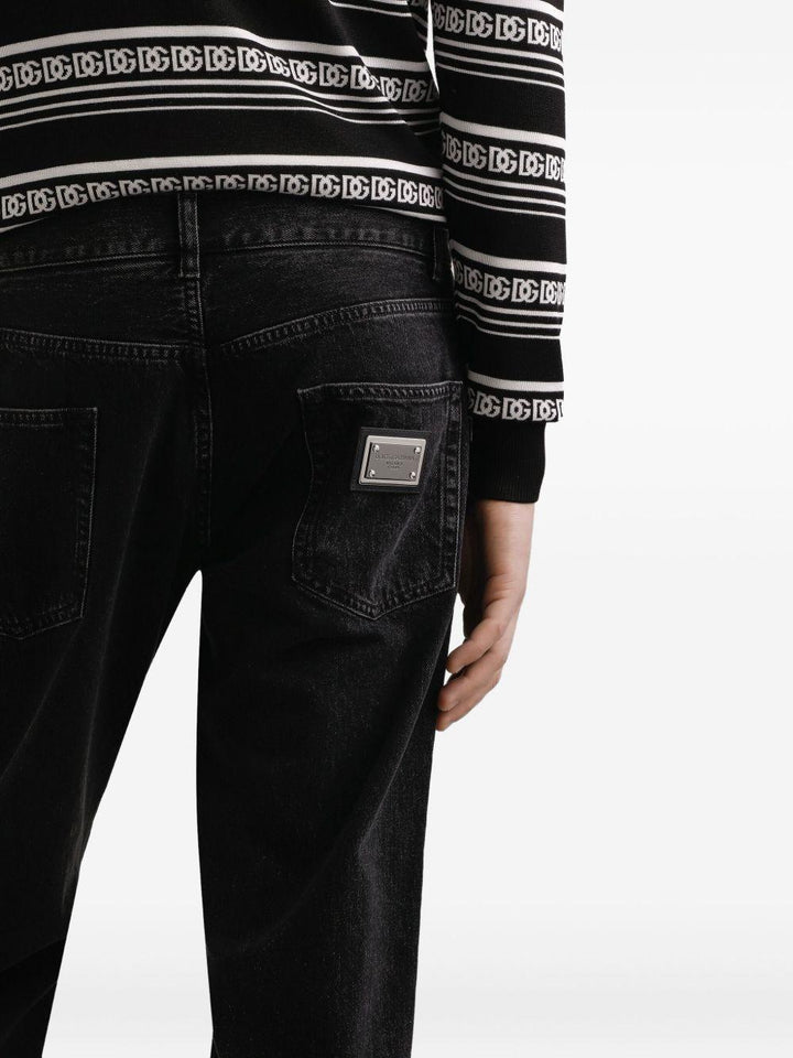 Jeans neri in cotone con applicazione logo