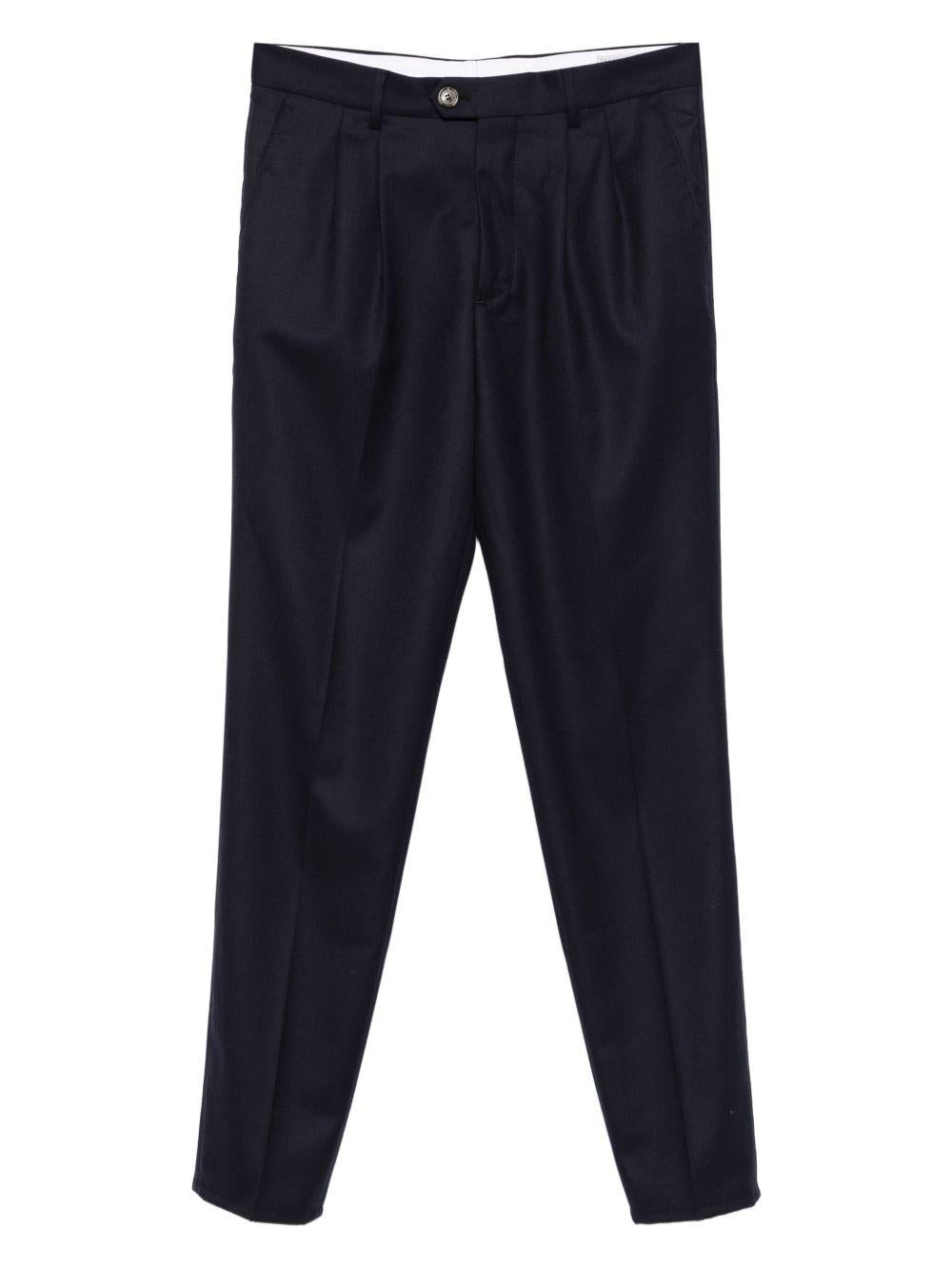 Pantaloni blu scuro in lana plissettati con patta e tasche a filetto 