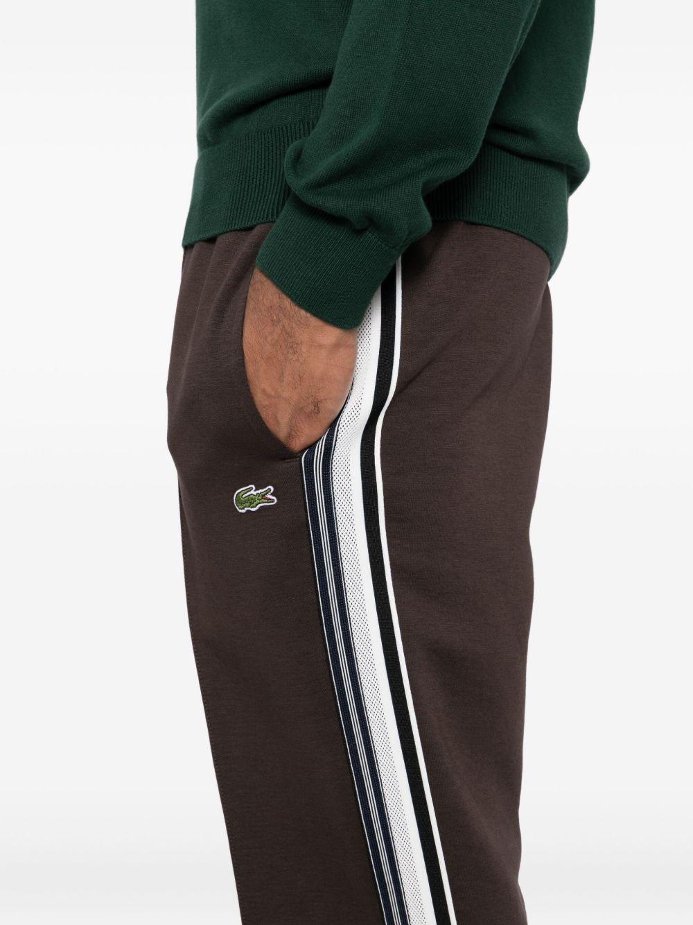 Pantaloni marrone cedro con logo