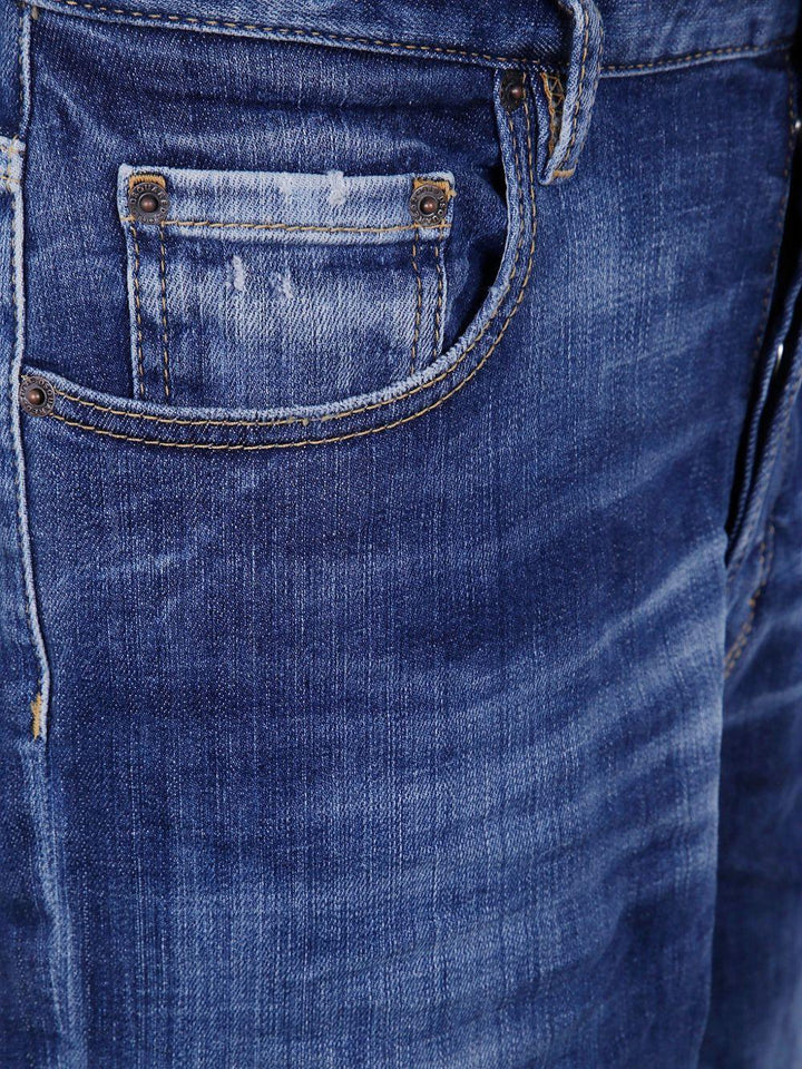 Jeans blu in cotone con effetto vissuto 