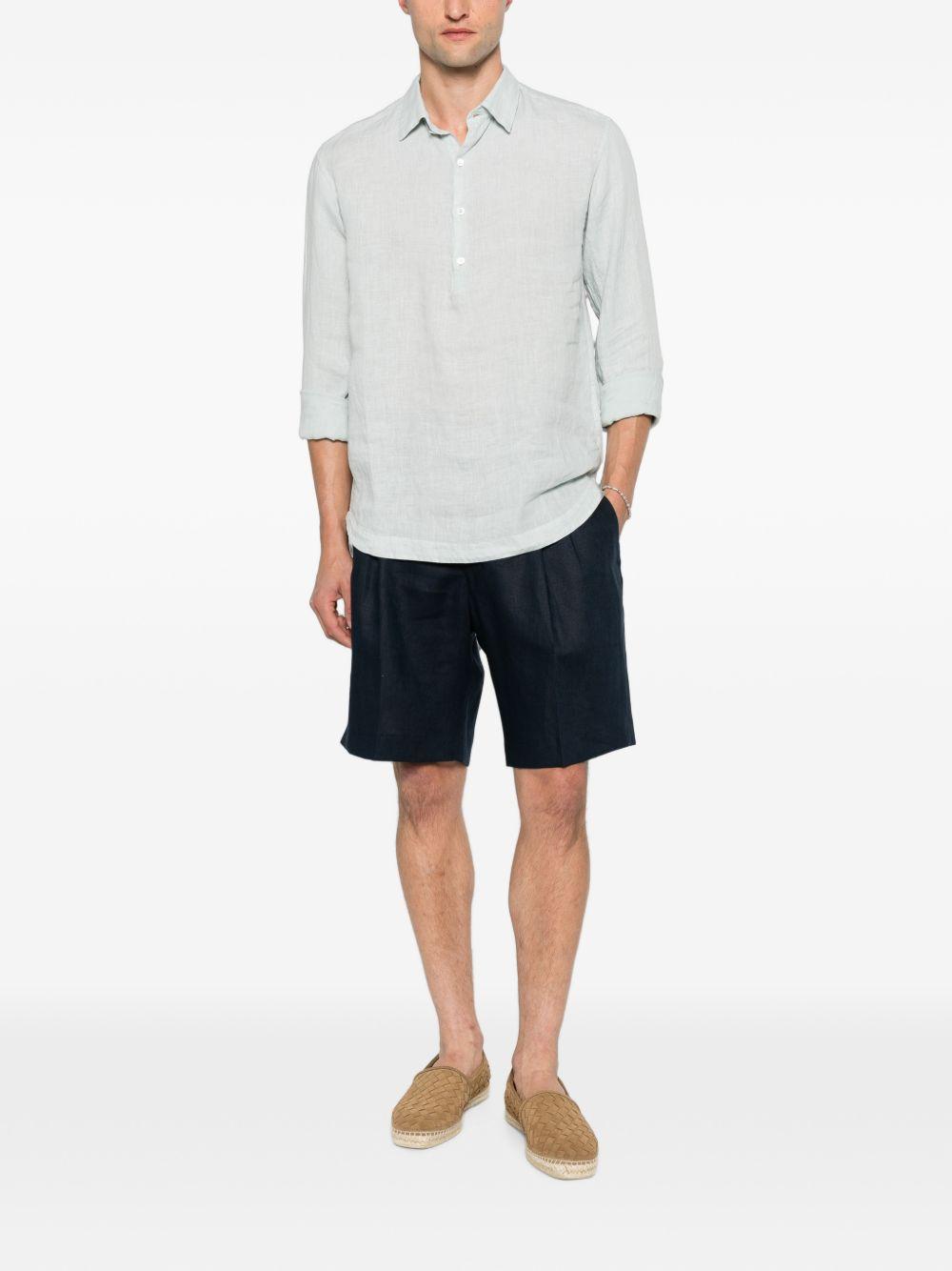 Shorts navy con pieghe 