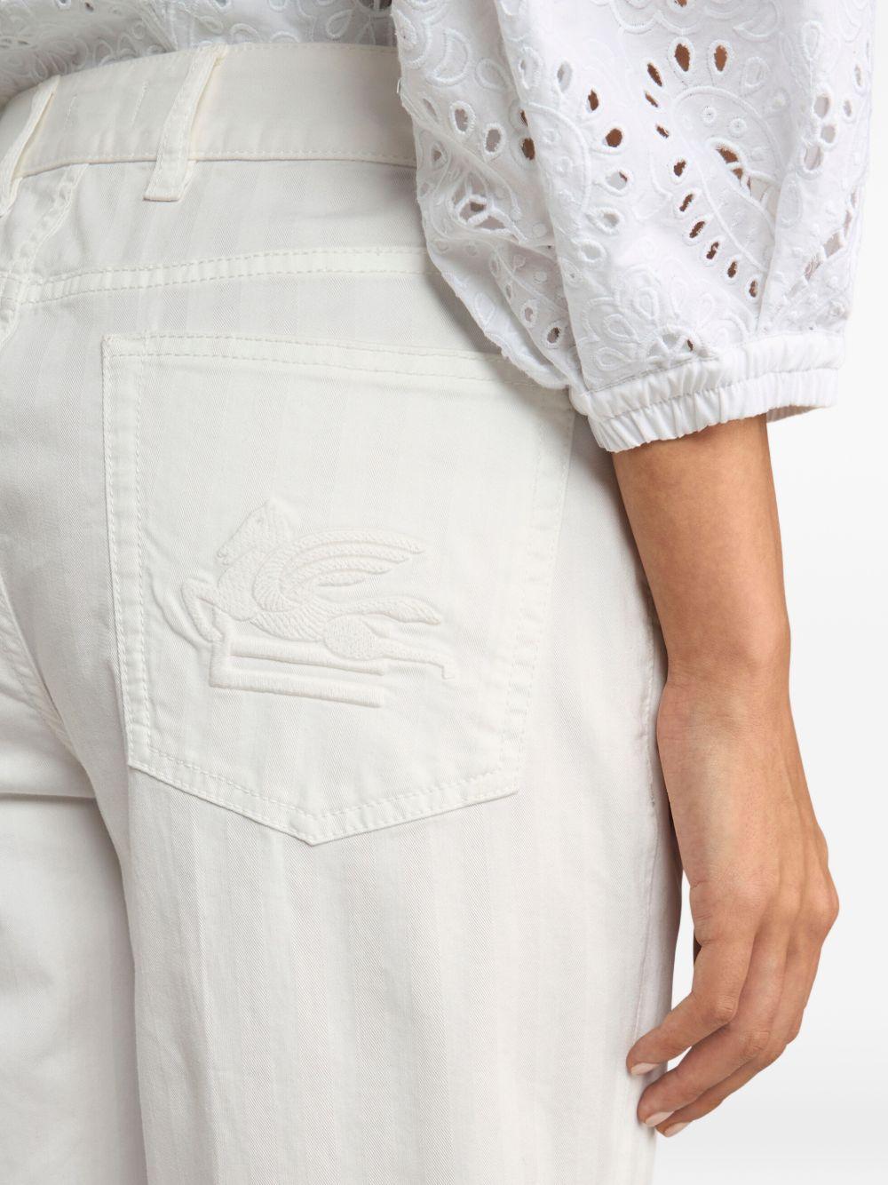 Jeans con ricamo Pegaso 