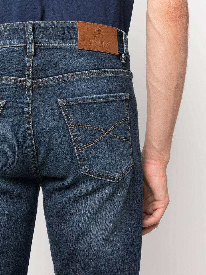 Jeans blu a vita media con logo inciso 