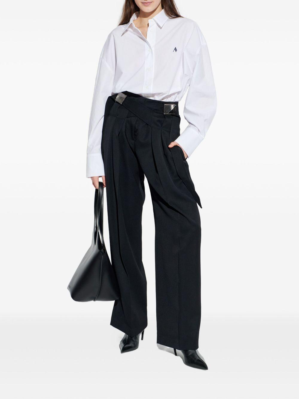 Pantaloni con fibbie 