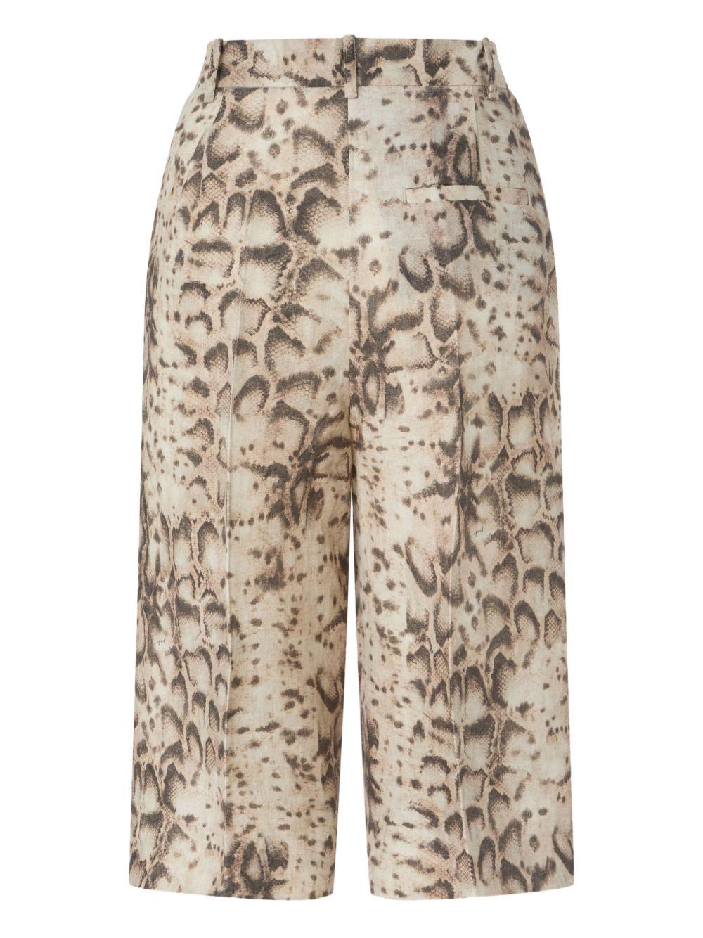 Pantaloni con stampa serpente 