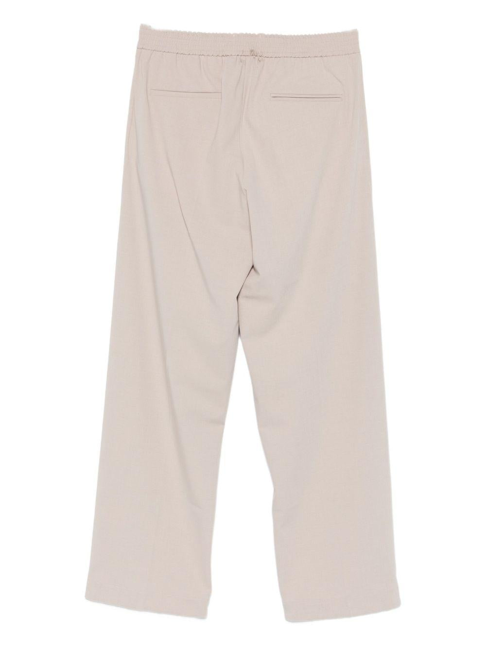 Pantaloni con piega beige 