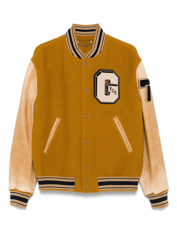 Giacca giallo mostarda con maniche in pelle e applicazione varsity 