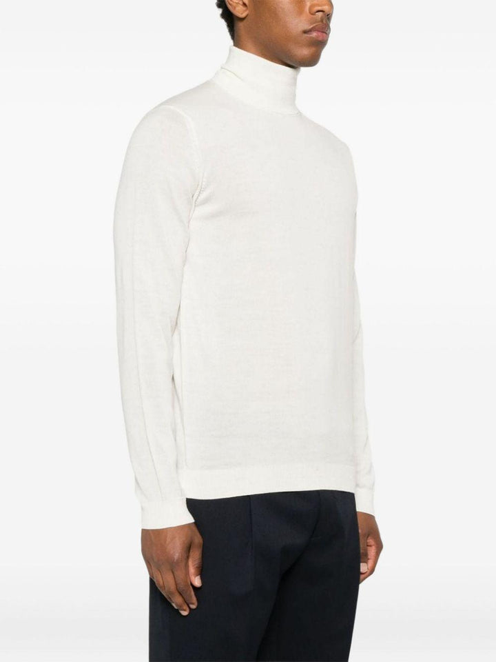 Maglione bianco opaco a collo alto in lana merino