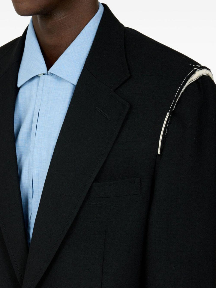 Blazer nero con spalline 