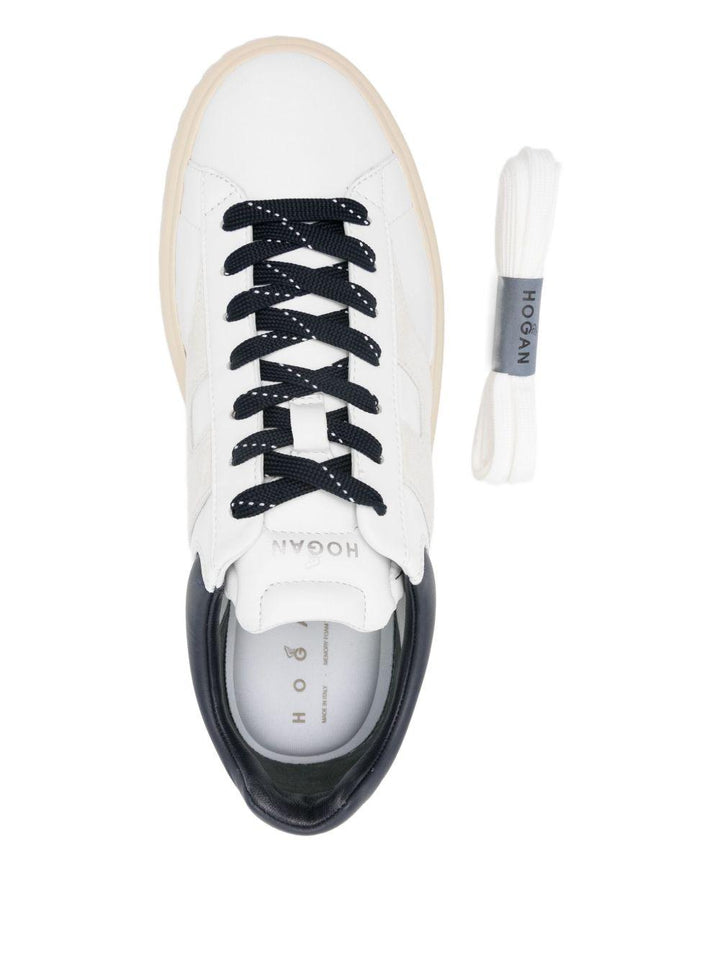 Sneakers bianche in pelle con suola rialzata 