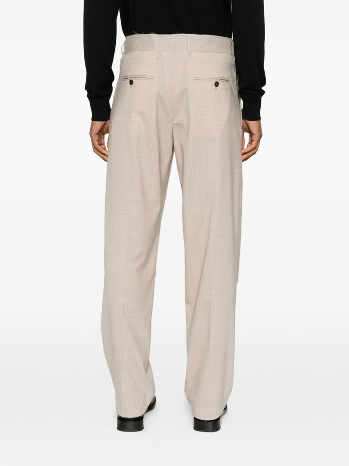 Pantaloni beige con pieghe e passanti 