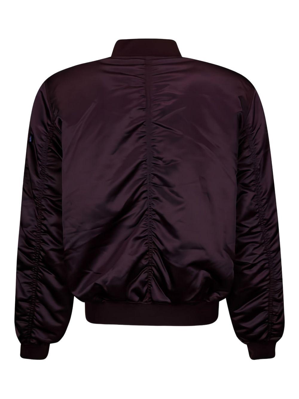 Bomber prugna con zip 