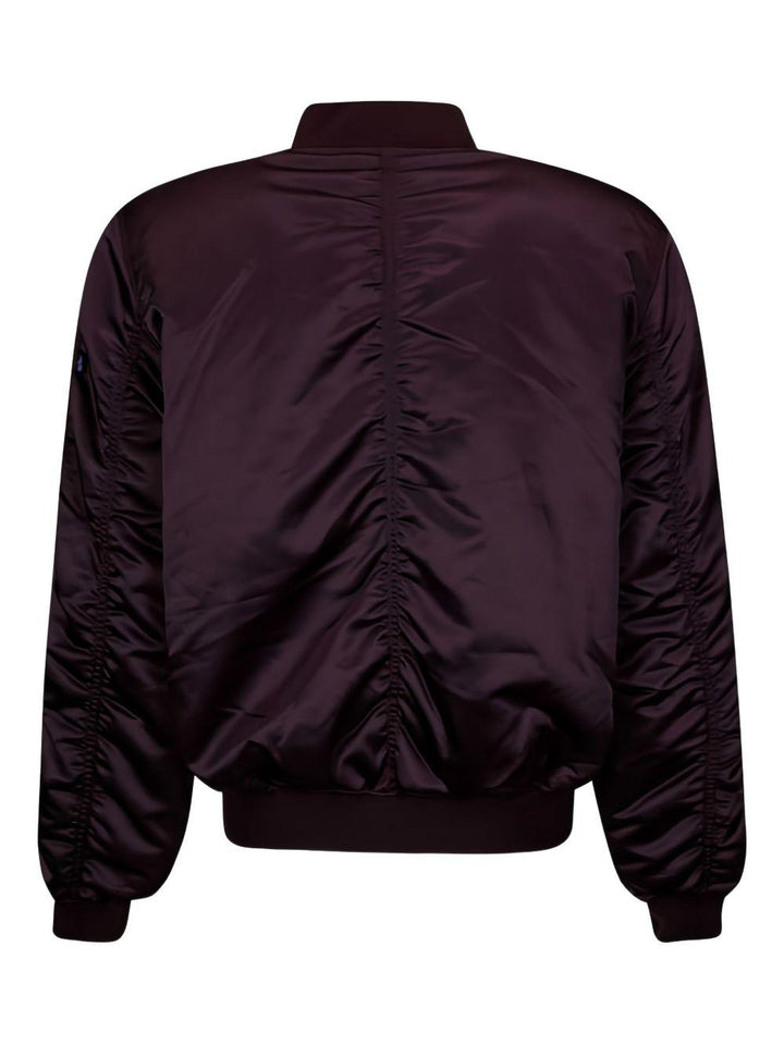 Bomber prugna con zip 