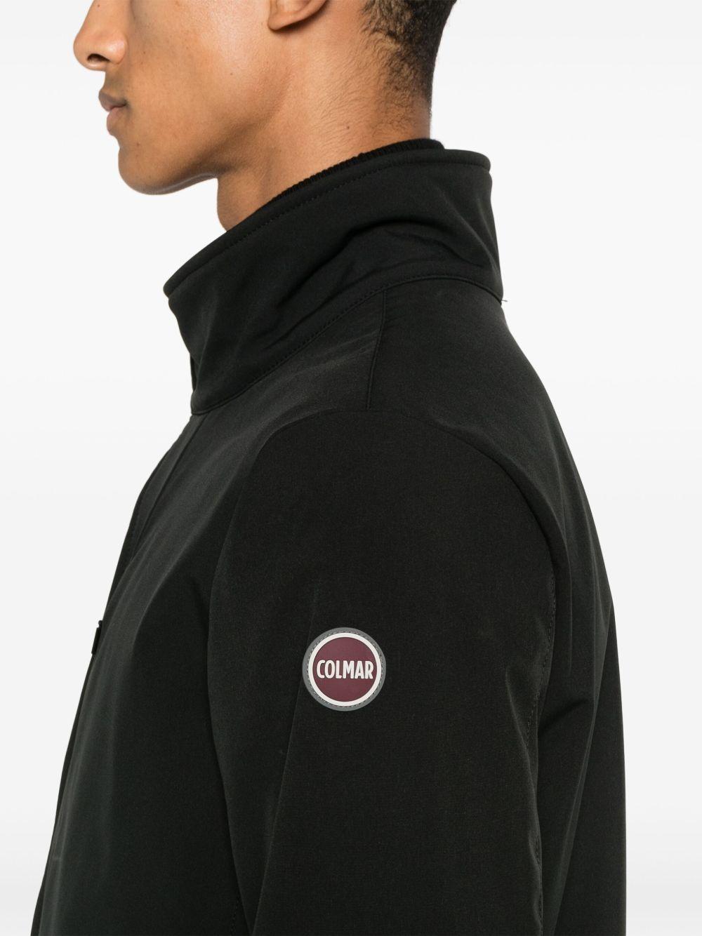 Cappotto nero con zip e logo gommato 