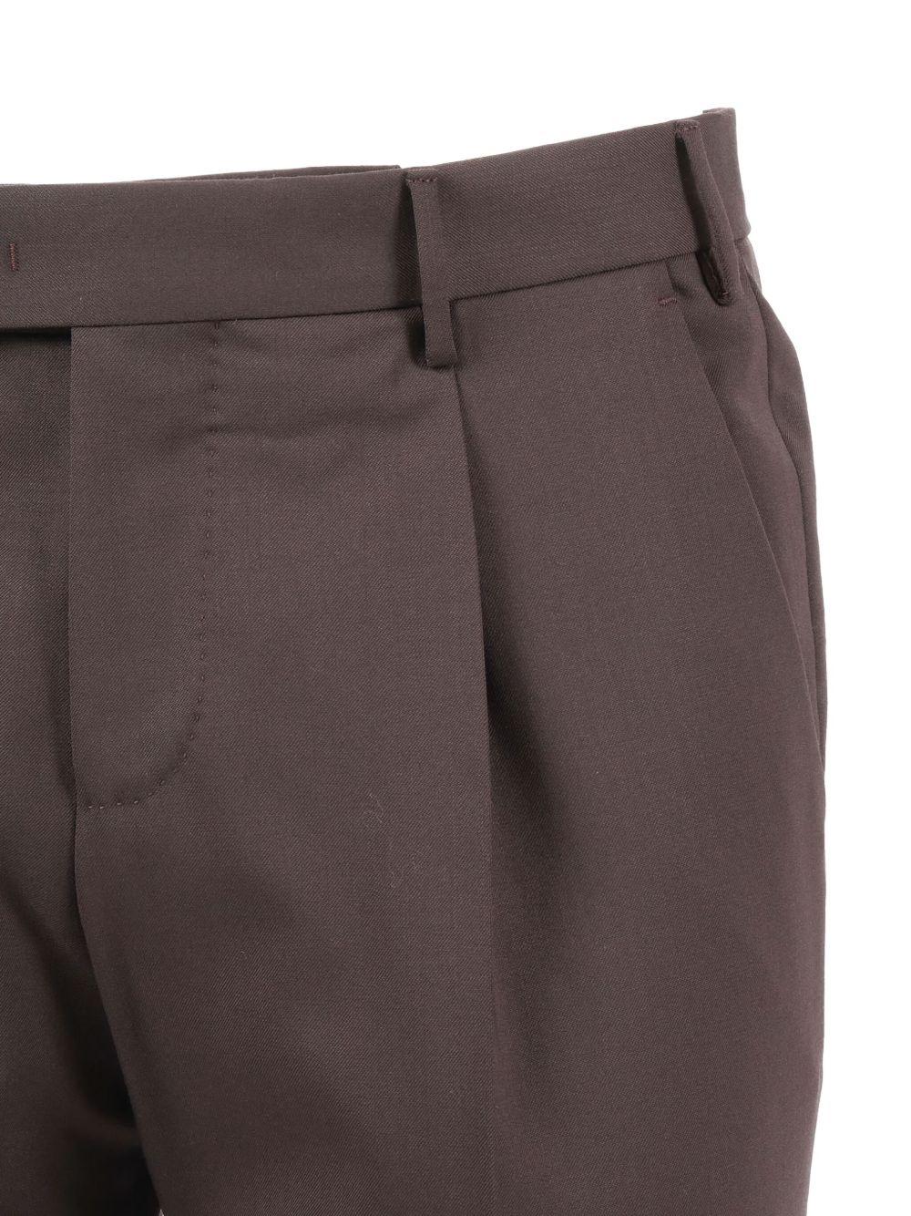 Pantaloni grigi con pieghe 