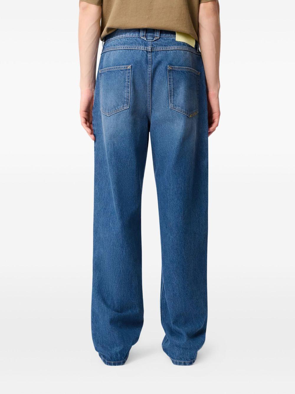 Jeans blu a gamba ampia con effetto vissuto 