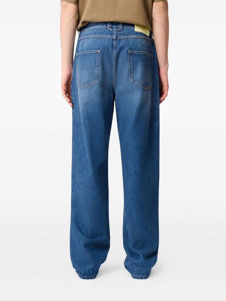 Jeans blu a gamba ampia con effetto vissuto 